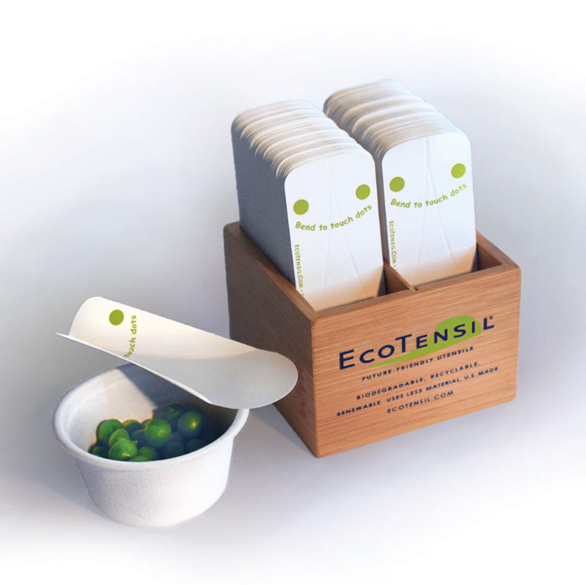EcoTaster Mini Starter Kit shown with a compostable cup of peas and comes with 1,000 Compostable mini sampling spoons and a bamboo dispenser.